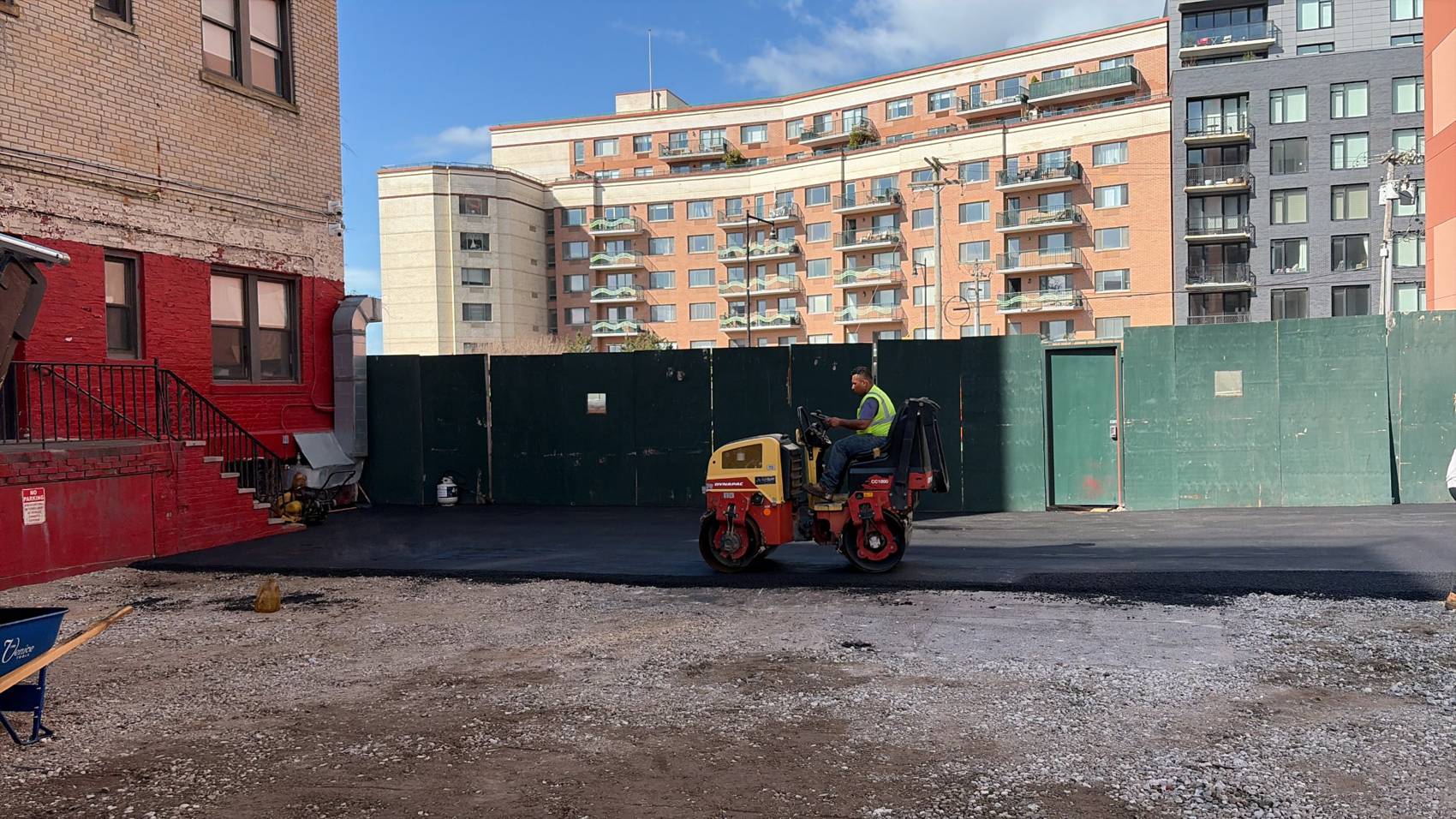 Roller compacting new asphalt in Belle Harbor, NY